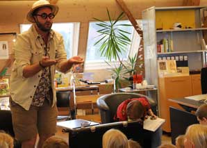 Interactive lecture for children with dinosaur researcher Archibald